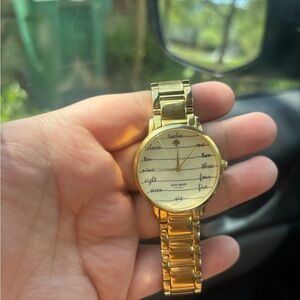 kate spade gold-tone bracelet watch with script dial